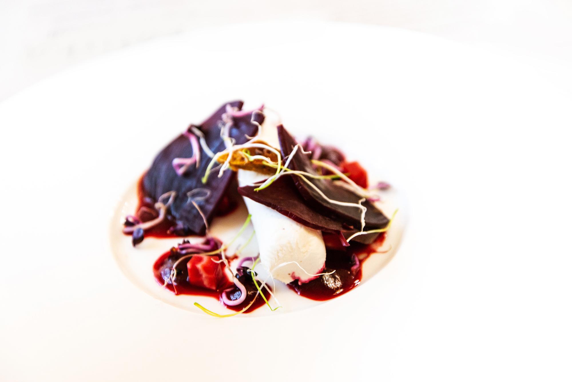 close-up of plated seasonal dish with tech-styled garnish